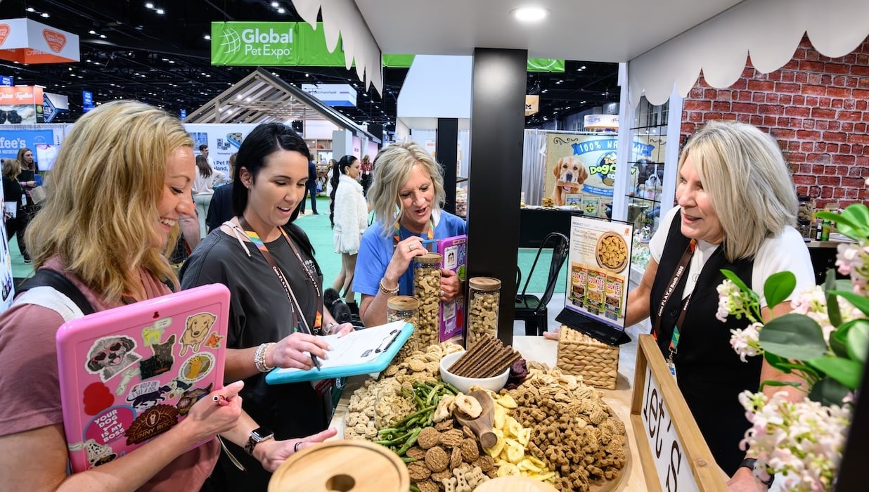 Global Exhibitor showing off her products.