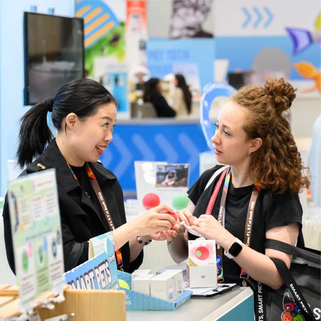 Two women discussing pet products